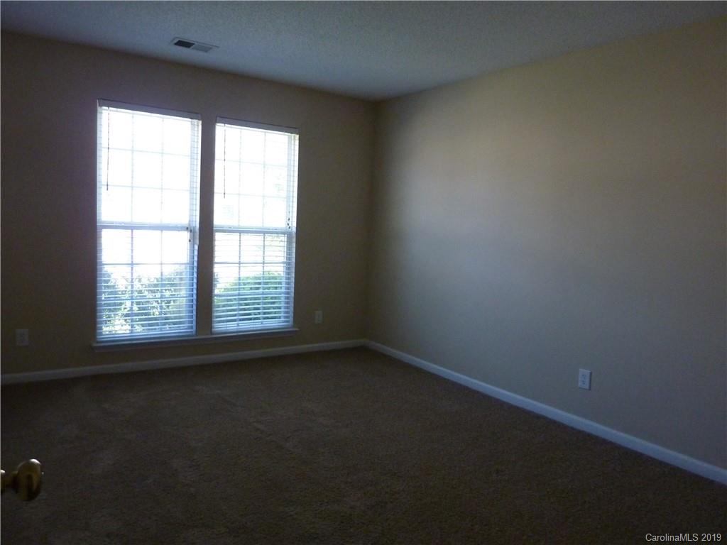 3607 Marbury Road Charlotte, NC 28269 - Photo 14 of 16 an empty room with a window