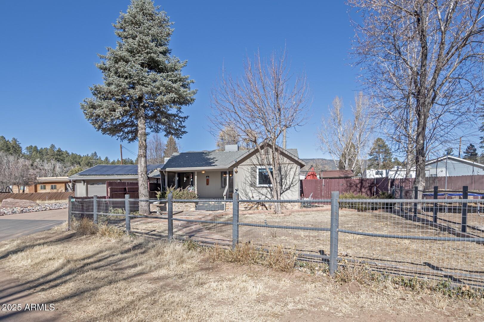 6066 S Road Pine, AZ 85544 - Photo 1 of 38 a house that has a tree in front of it
