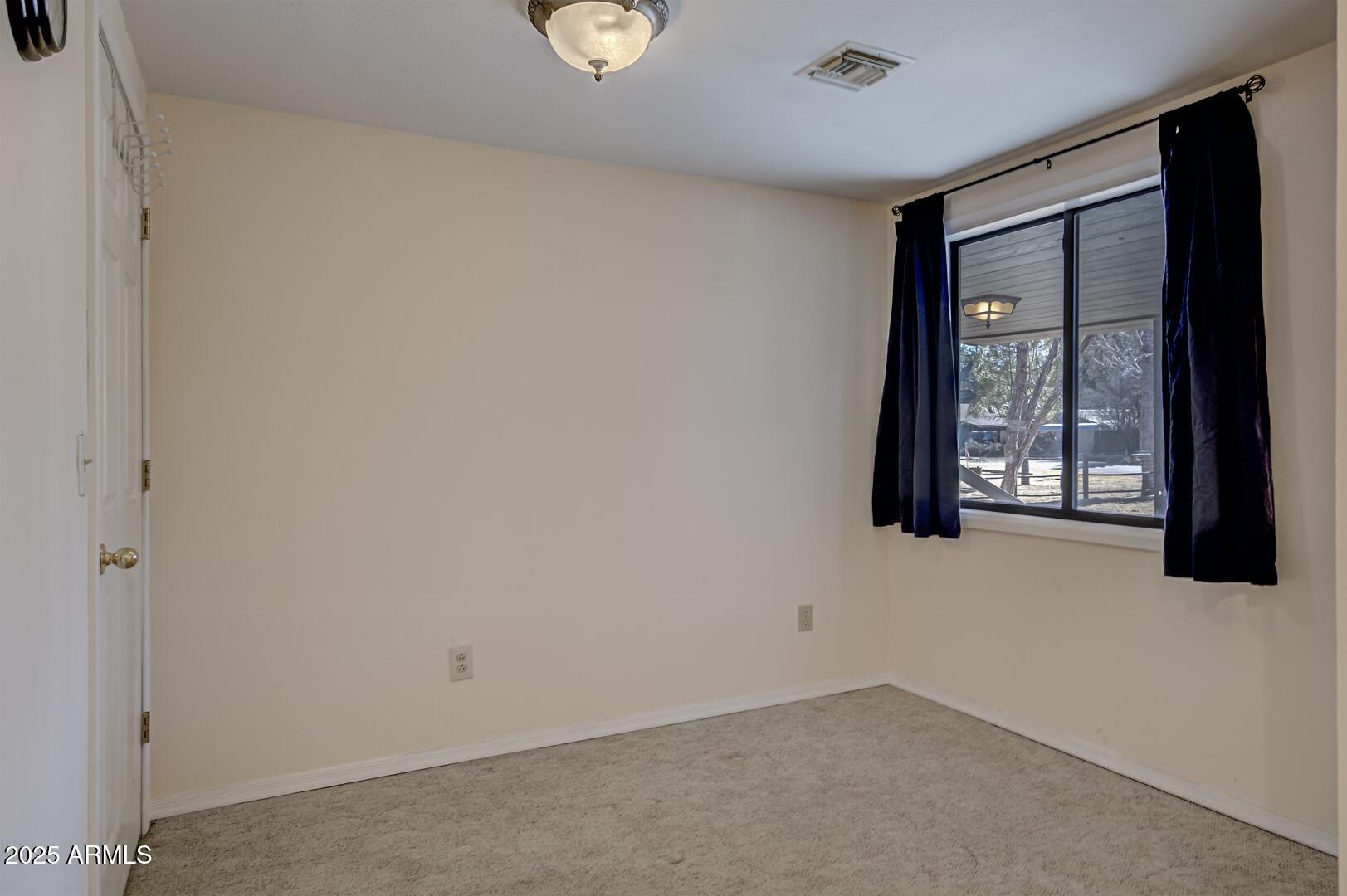 6066 S Road Pine, AZ 85544 - Photo 12 of 38 an empty room with windows