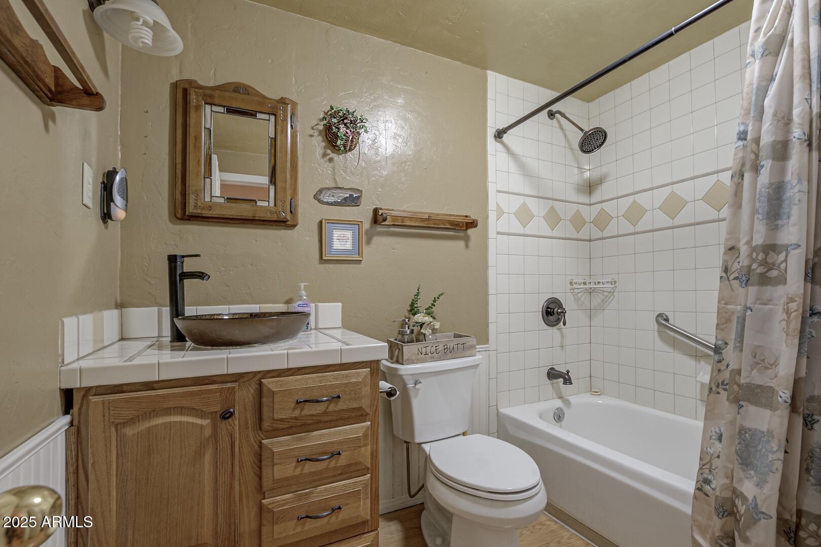 6066 S Road Pine, AZ 85544 - Photo 14 of 38 a bathroom with a granite countertop sink toilet and shower