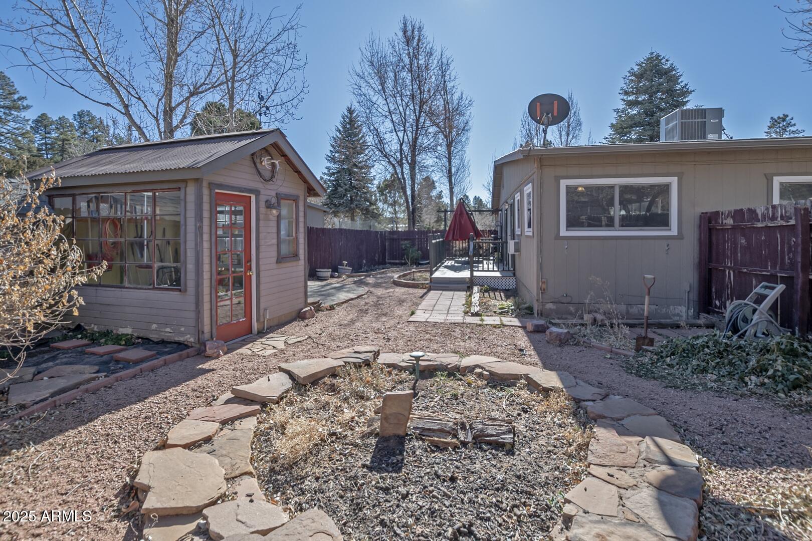 6066 S Road Pine, AZ 85544 - Photo 34 of 38 a front view of a house with garden