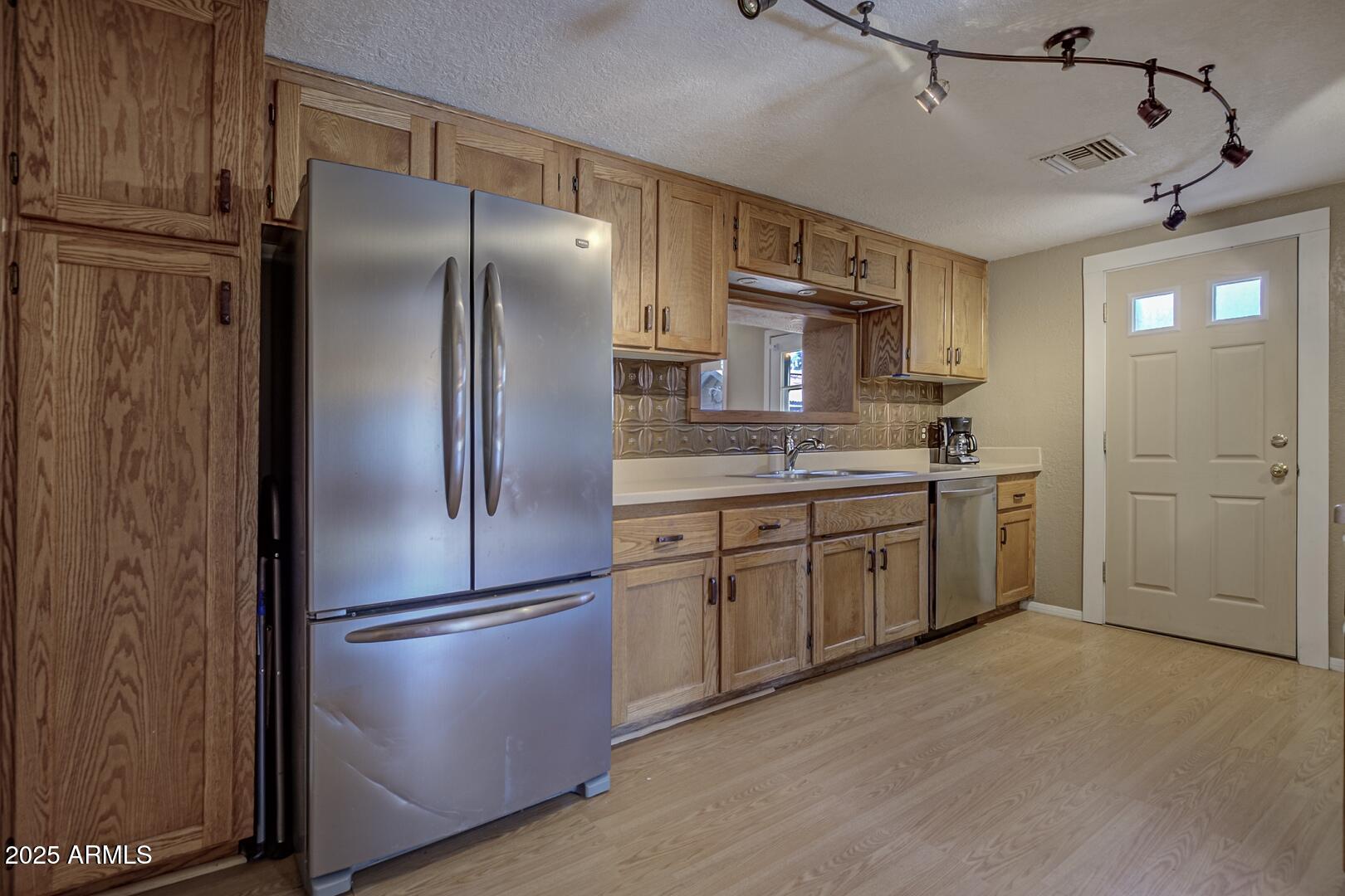 6066 S Road Pine, AZ 85544 - Photo 8 of 38 a kitchen with stainless steel appliances granite countertop a refrigerator and a stove top oven