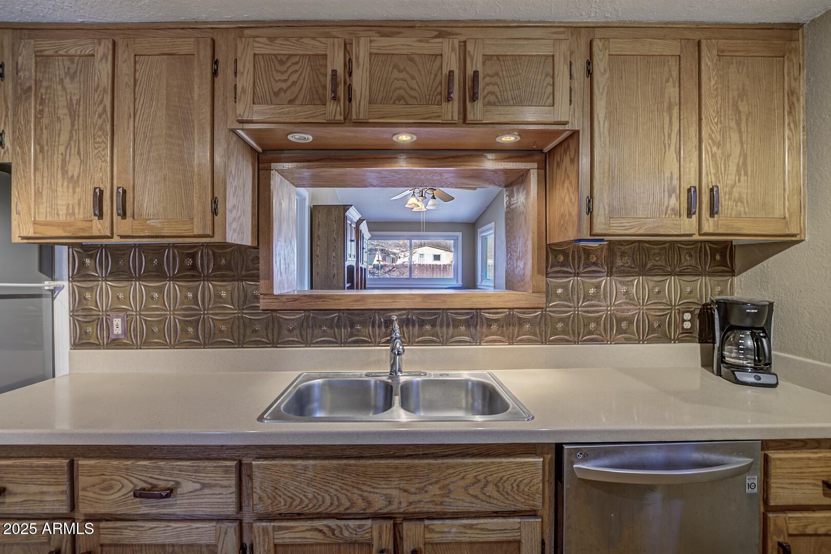 6066 S Road Pine, AZ 85544 - Photo 10 of 38 a kitchen with a sink and cabinets