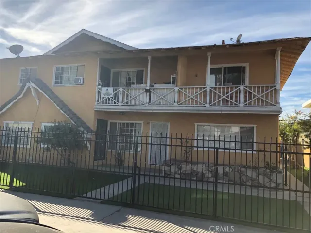 a front view of house yard and car parked