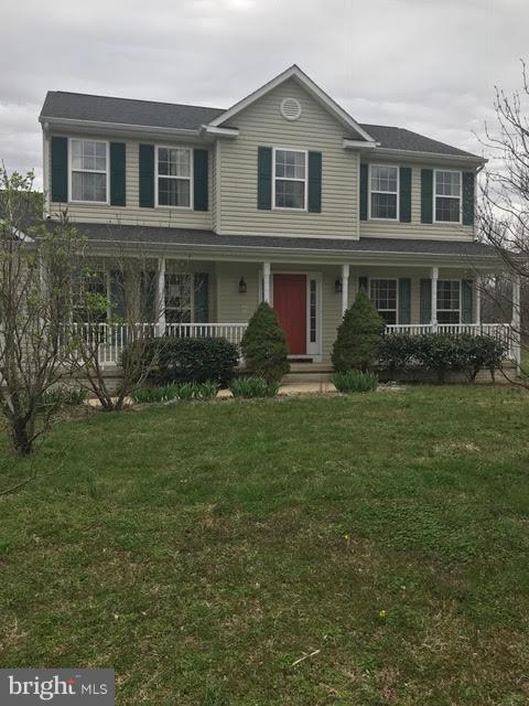 6990 Stuart Road King George, VA 22485 - Photo 1 of 15 a front view of a house with a yard