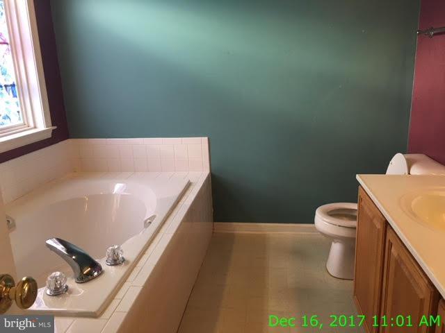 6990 Stuart Road King George, VA 22485 - Photo 11 of 15 a bathroom with a sink and a toilet