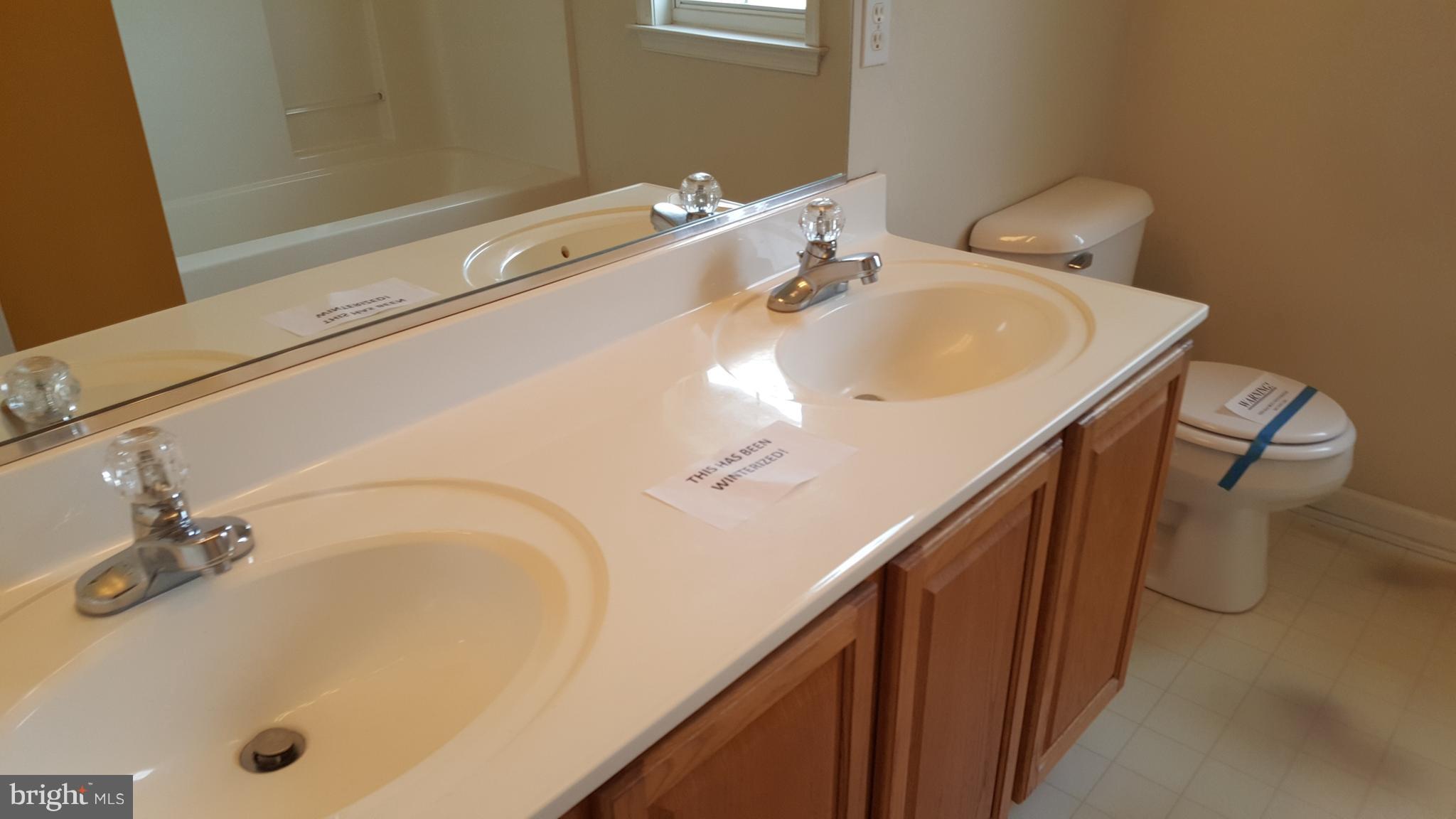 6990 Stuart Road King George, VA 22485 - Photo 12 of 15 a bathroom with a sink and a tub