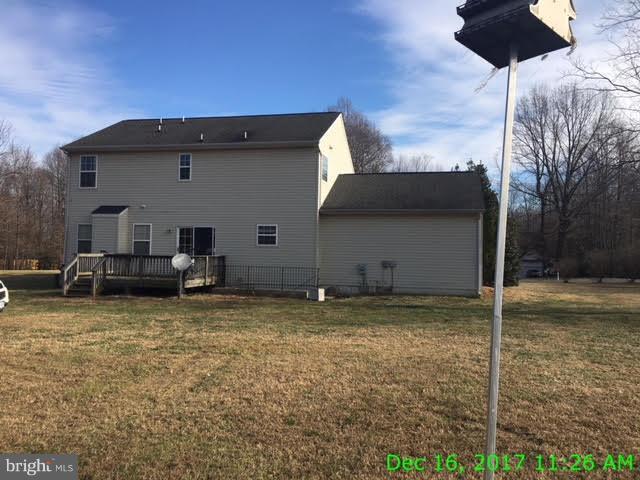 6990 Stuart Road King George, VA 22485 - Photo 13 of 15 a backyard of a house with barbeque oven