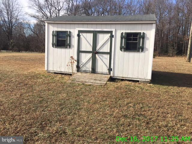 6990 Stuart Road King George, VA 22485 - Photo 15 of 15 a view of a front view of a house with a yard