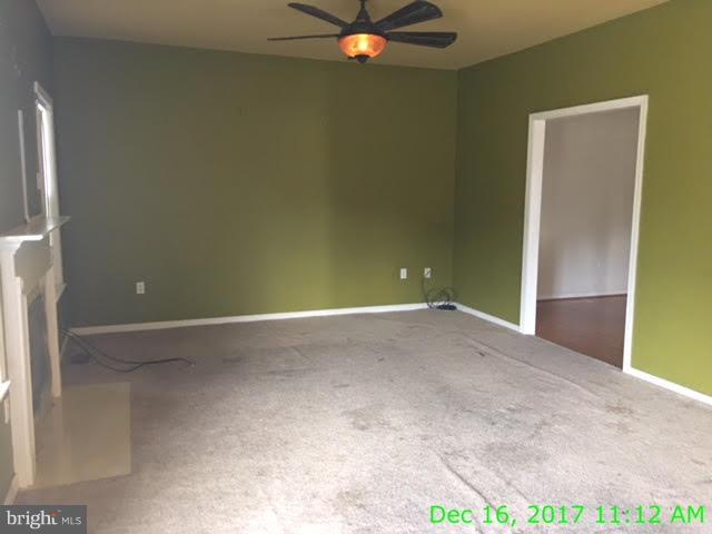 6990 Stuart Road King George, VA 22485 - Photo 4 of 15 an empty room with closet and fan
