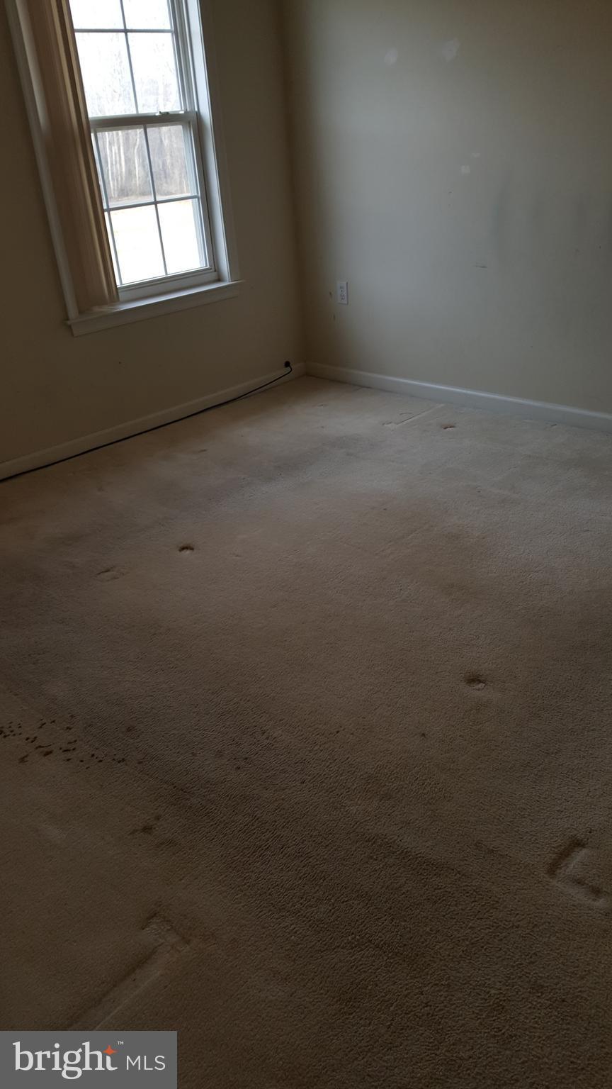 6990 Stuart Road King George, VA 22485 - Photo 7 of 15 an empty room with a window