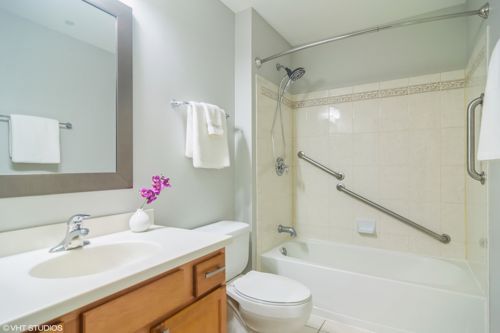 125 North Buffalo Grove Road, Unit 110 Buffalo Grove, IL 60089 - Photo 12 of 14 a bathroom with a sink toilet vanity and shower