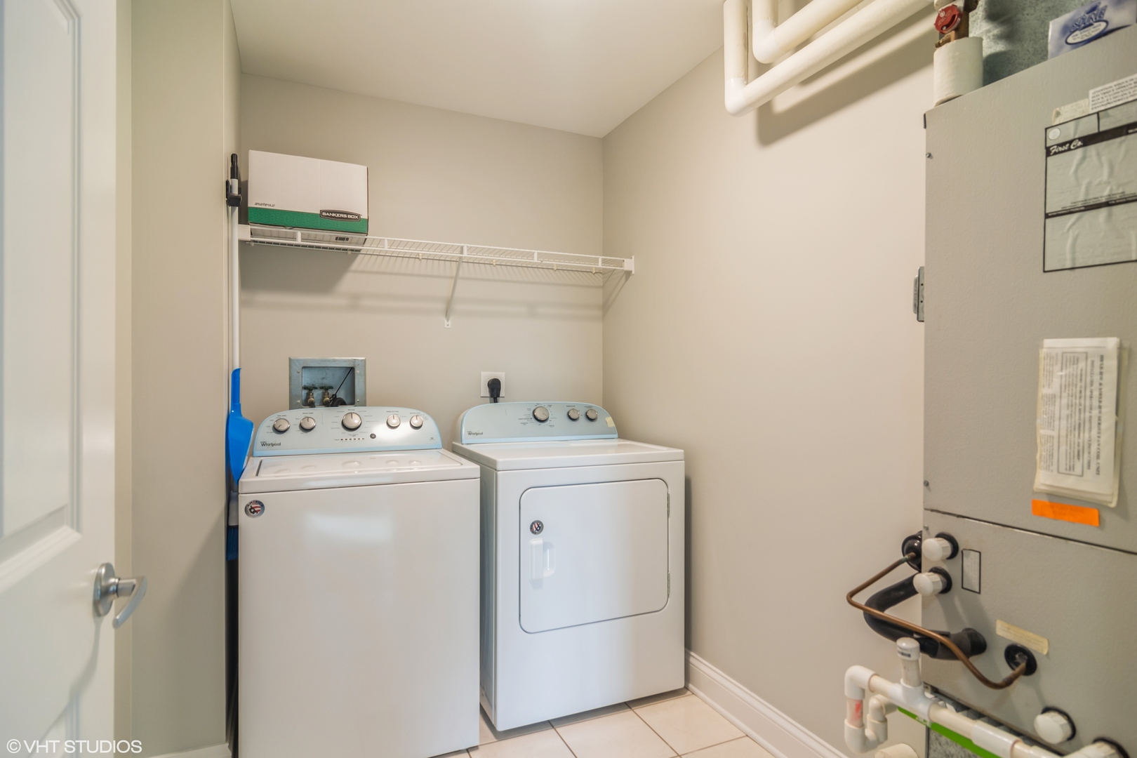 125 North Buffalo Grove Road, Unit 110 Buffalo Grove, IL 60089 - Photo 13 of 14 a utility room with dryer and washer