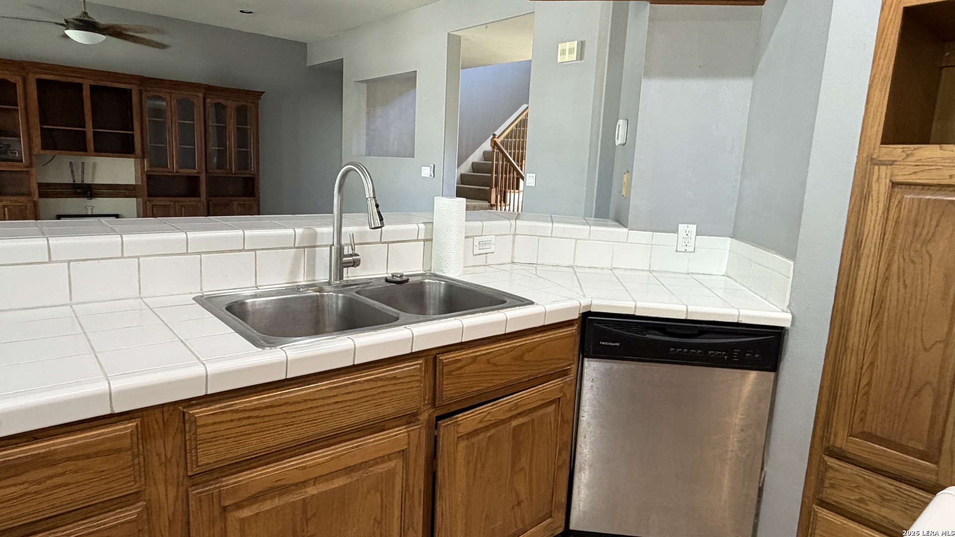 10565 Briggs Road Atascosa, TX 78002 - Photo 31 of 59 a kitchen with a sink and a refrigerator
