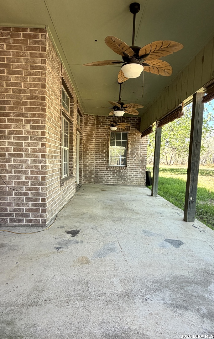 10565 Briggs Road Atascosa, TX 78002 - Photo 34 of 59 a view of a house with a porch