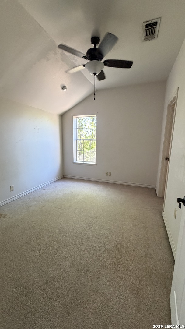 10565 Briggs Road Atascosa, TX 78002 - Photo 41 of 59 an empty room with windows and ceiling fan