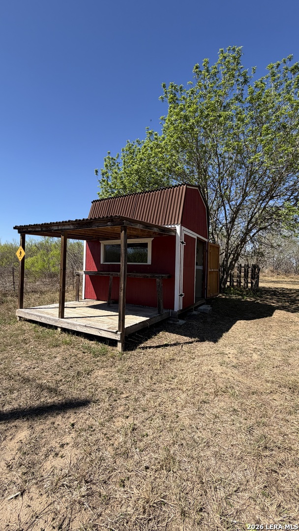 10565 Briggs Road Atascosa, TX 78002 - Photo 51 of 59 a view of a house with a yard
