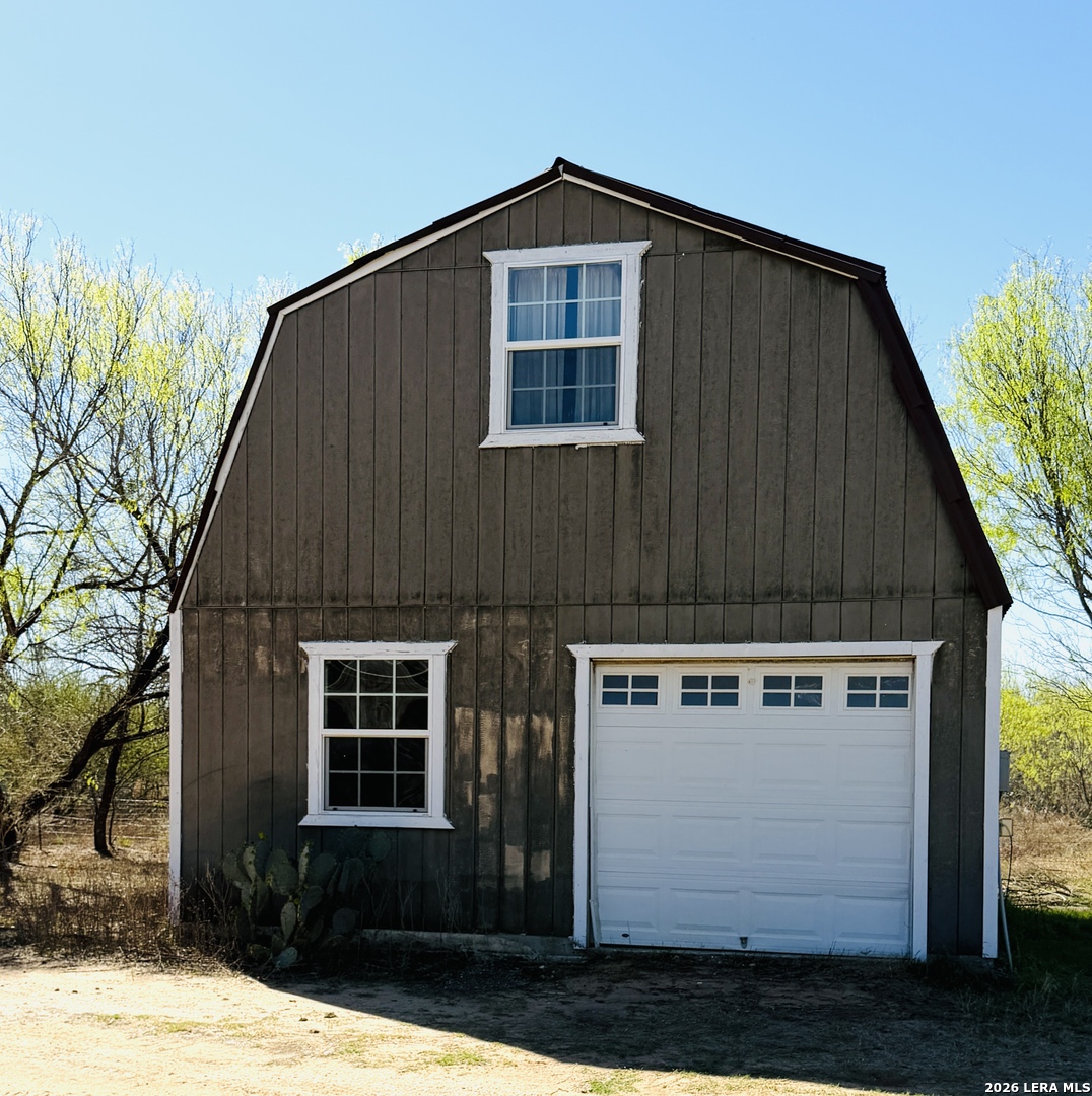 10565 Briggs Road Atascosa, TX 78002 - Photo 54 of 59 a front view of a house with a yard