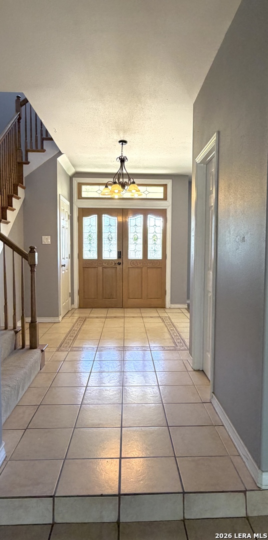 10565 Briggs Road Atascosa, TX 78002 - Photo 8 of 59 a view of an empty room with window and wooden floor