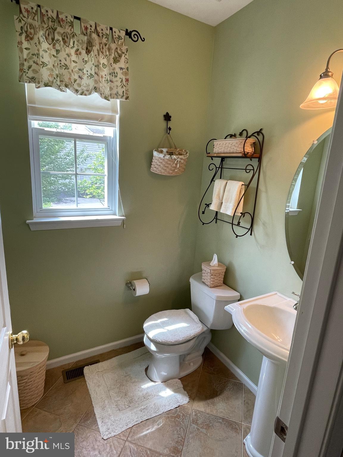 916 Nottingham Road Pottstown, PA 19465 - Photo 12 of 48 a white toilet sitting next to a bathroom sink