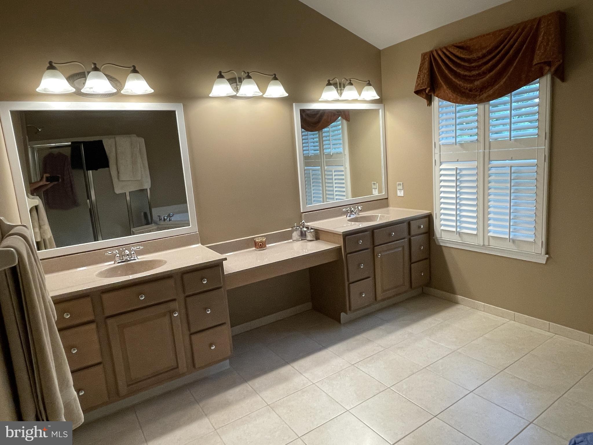916 Nottingham Road Pottstown, PA 19465 - Photo 23 of 48 a spacious bathroom with a sink double vanity and a mirror