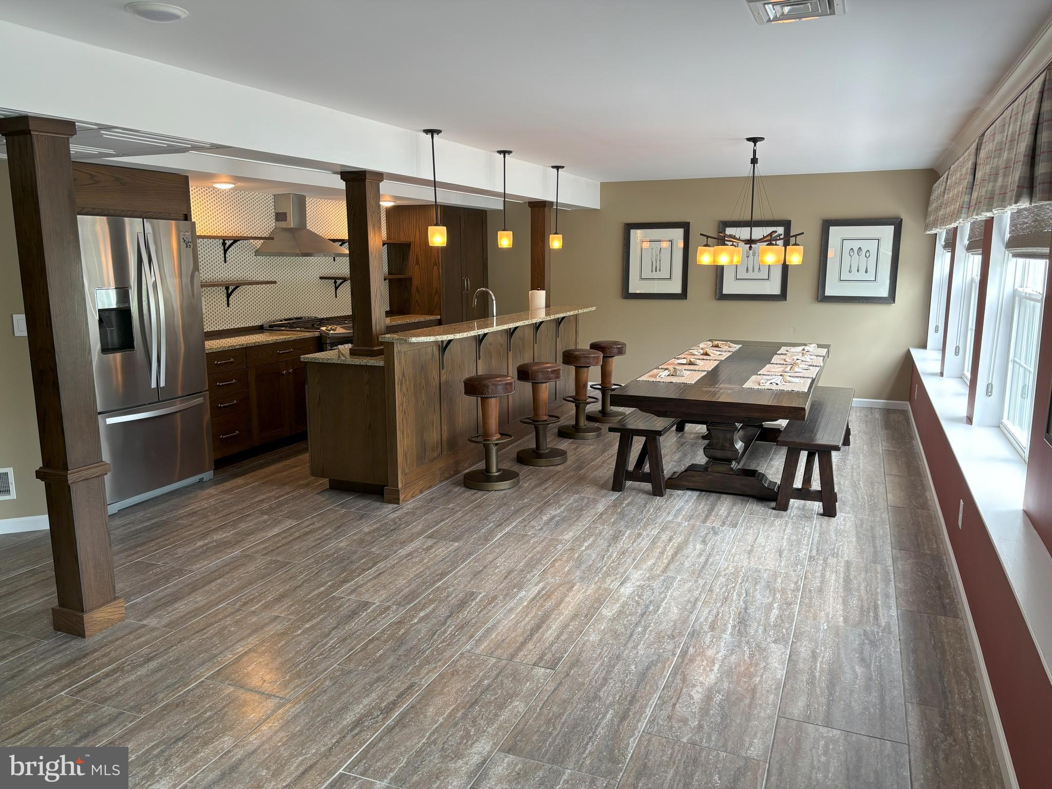 916 Nottingham Road Pottstown, PA 19465 - Photo 36 of 48 a open kitchen with stainless steel appliances granite countertop a refrigerator dining table and chairs