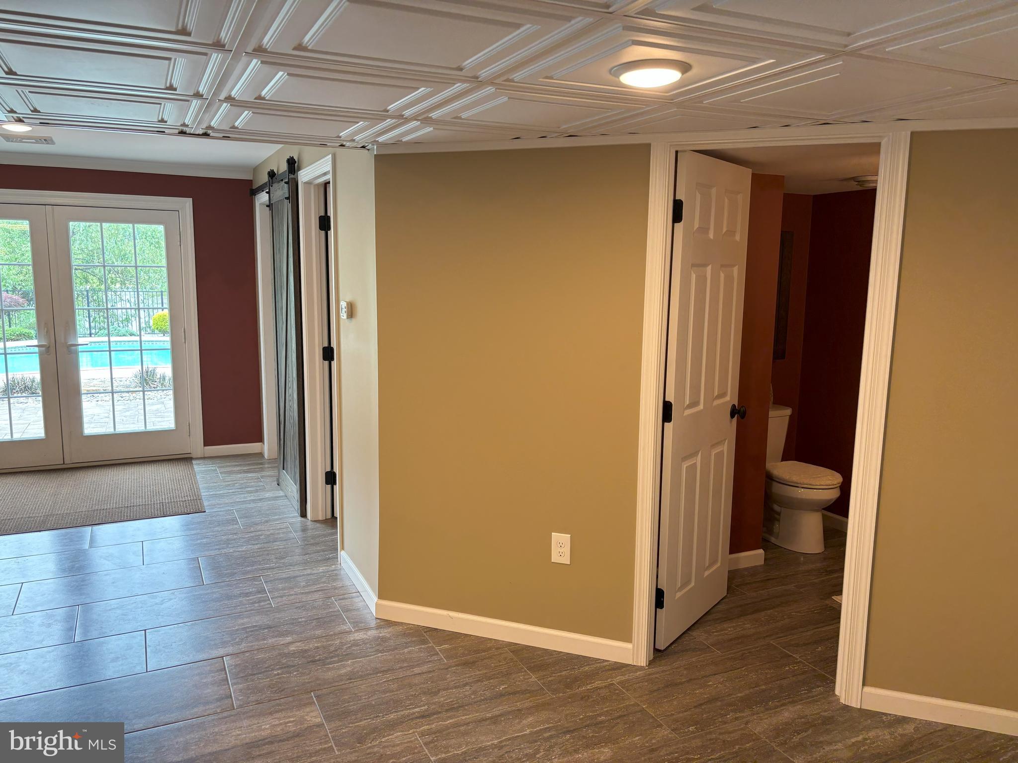 916 Nottingham Road Pottstown, PA 19465 - Photo 39 of 48 a view of a hallway with wooden floor and a bathroom
