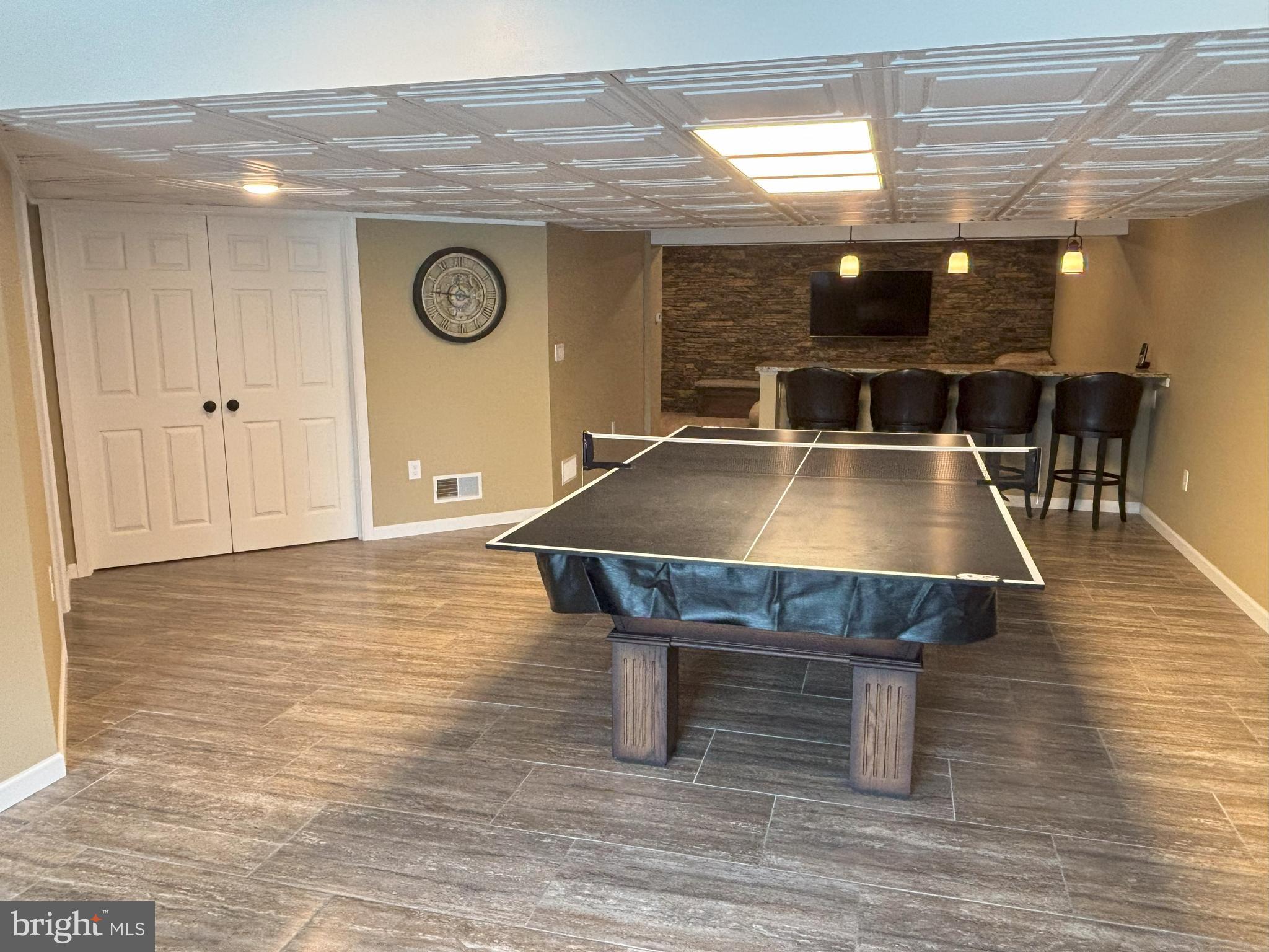 916 Nottingham Road Pottstown, PA 19465 - Photo 40 of 48 a room with table tennis table and arcade game machine with wooden floor