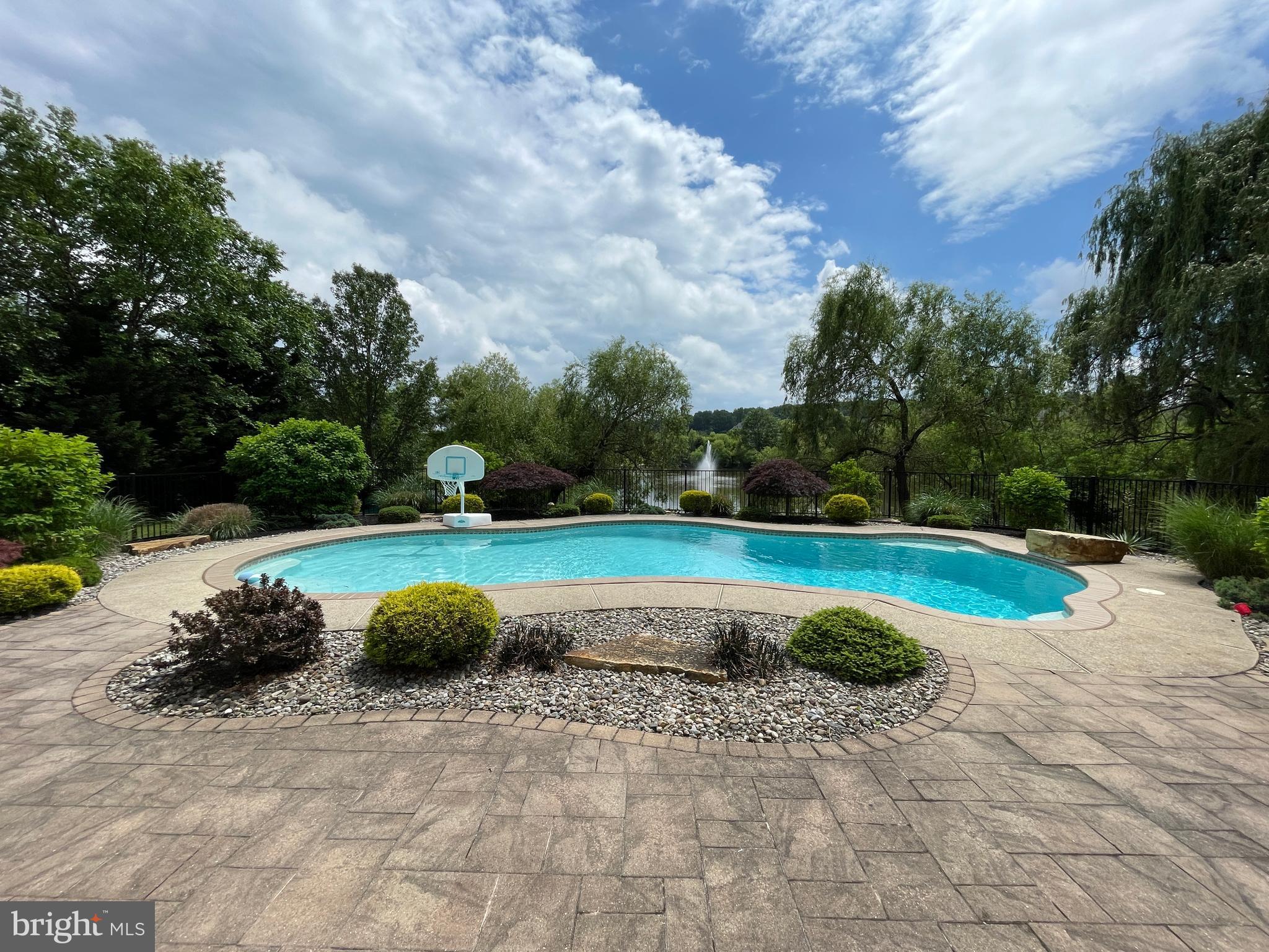 916 Nottingham Road Pottstown, PA 19465 - Photo 41 of 48 a view of a swimming pool with a yard