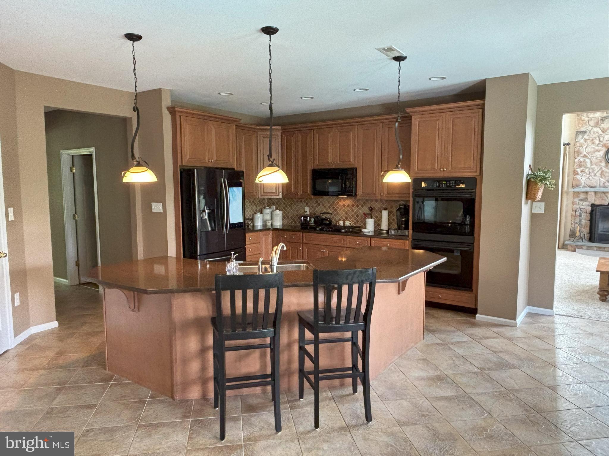 916 Nottingham Road Pottstown, PA 19465 - Photo 6 of 48 a kitchen with a table and chairs in it