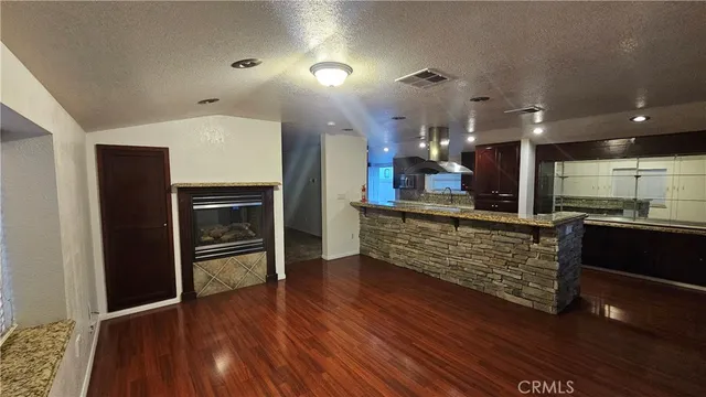 an open kitchen with a sink and dishwasher cabinets