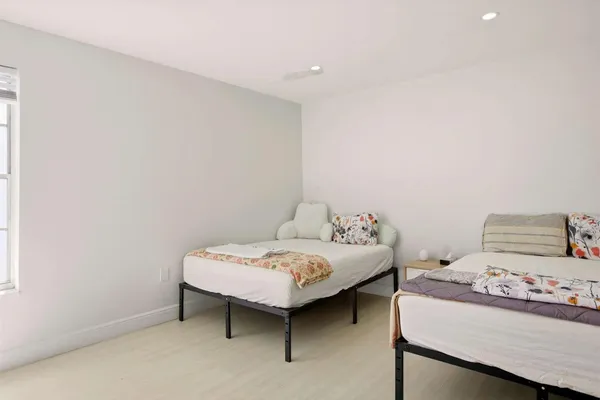 a bedroom with a bed and a table in it