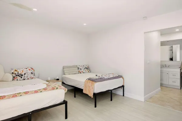 a bedroom with a bed and a table in it