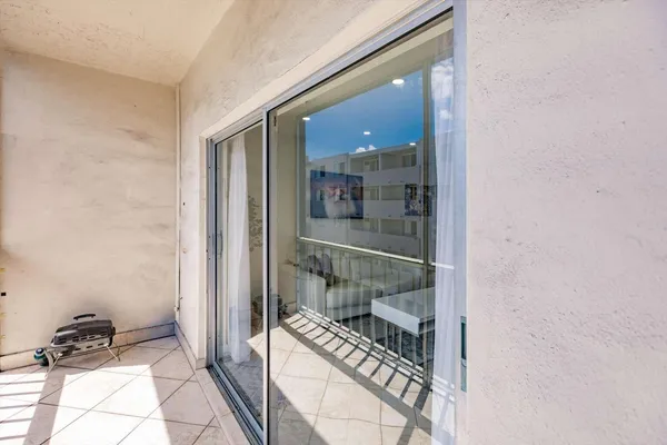 a bathroom with a sink and glass door