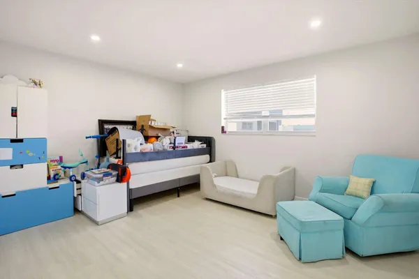 a bed room with furniture and a window