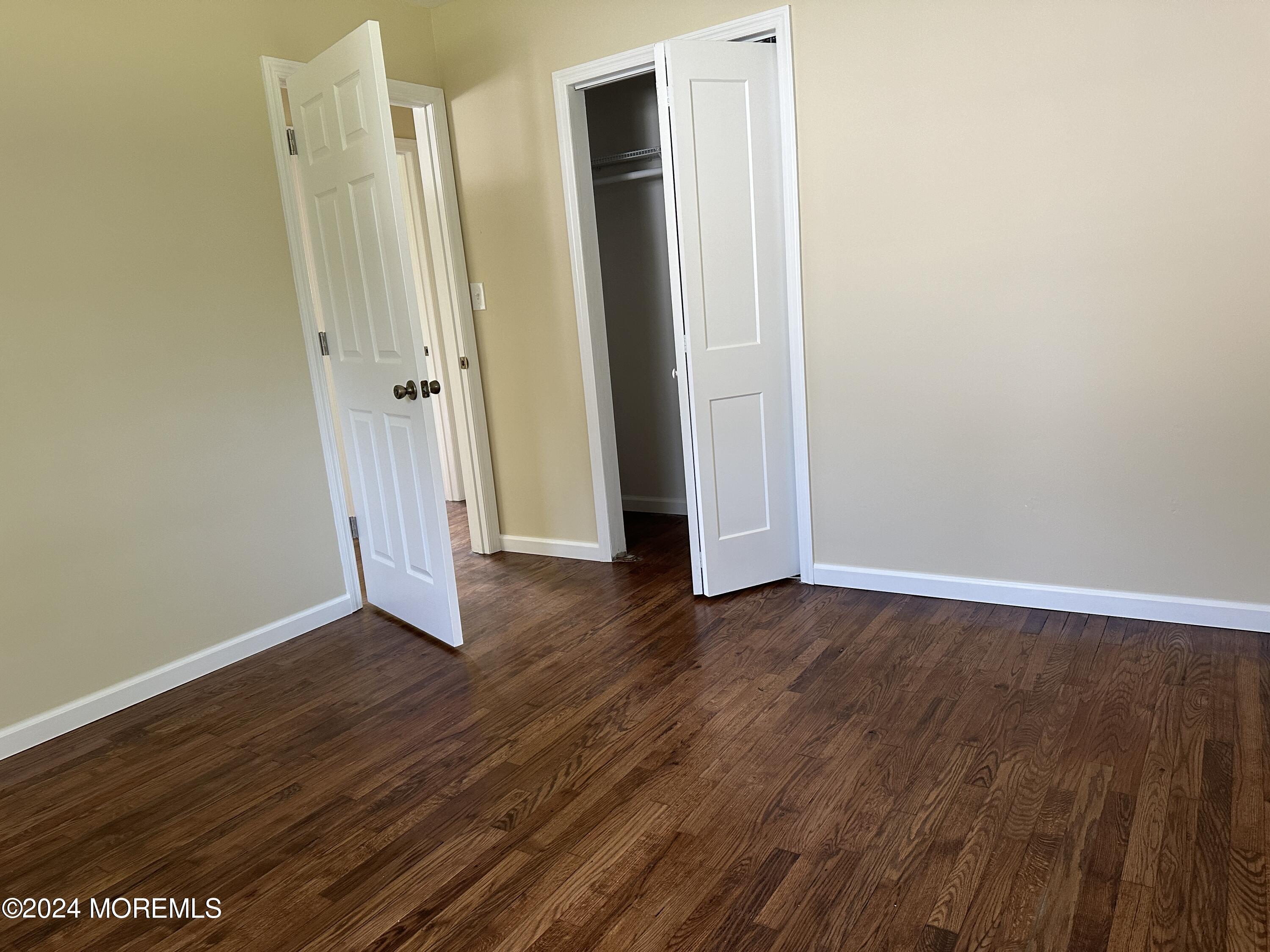 21 Middlesex Road Matawan, NJ 07747 - Photo 15 of 19 an empty room with wooden floor and closet