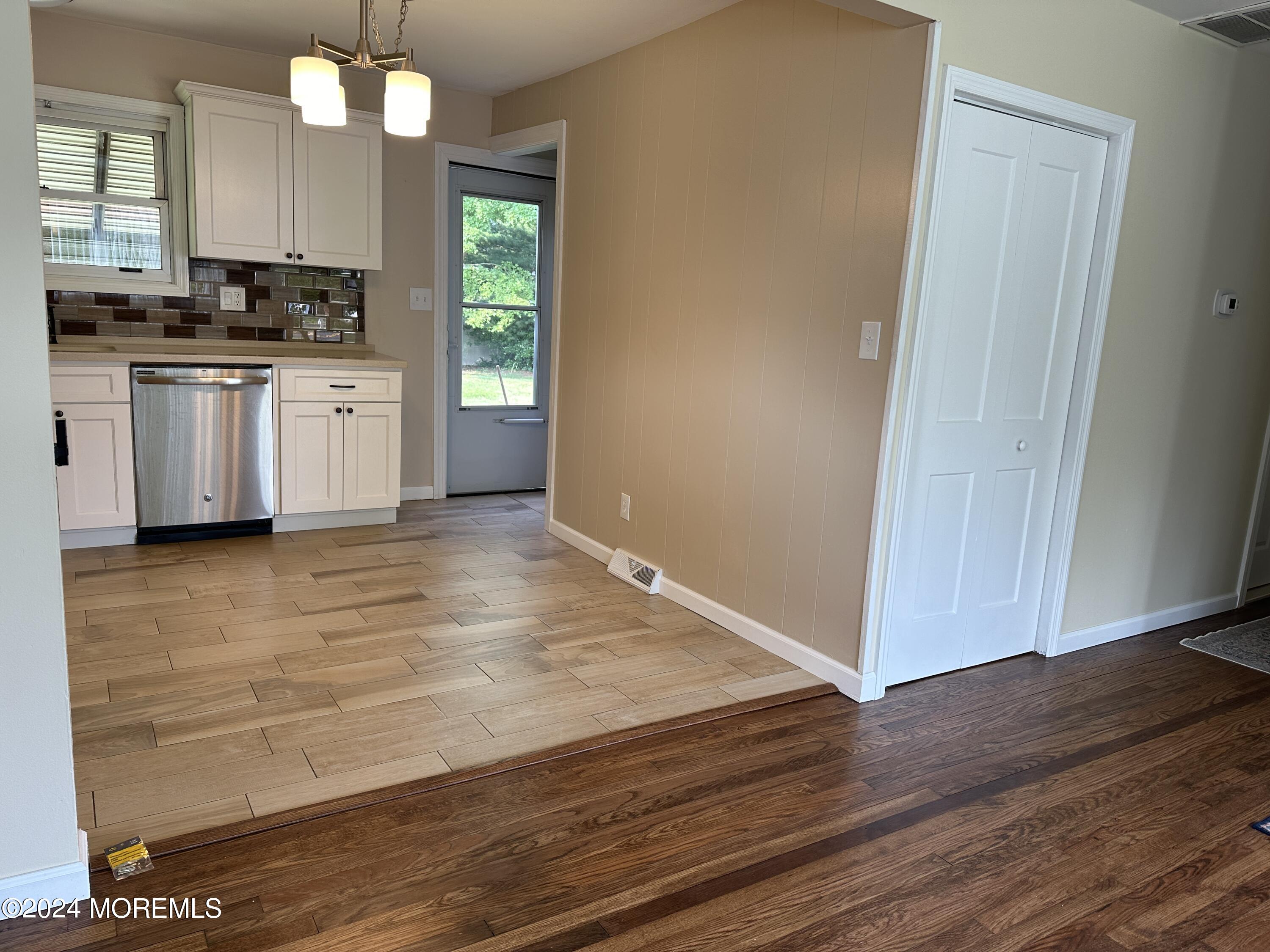 21 Middlesex Road Matawan, NJ 07747 - Photo 8 of 19 a kitchen with granite countertop wooden cabinets and white appliances