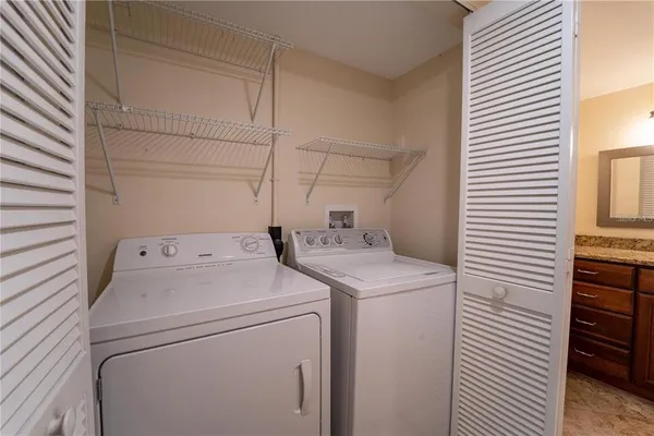 a utility room with dryer and washer