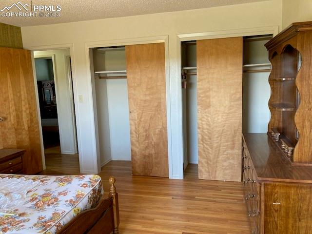 355 North Rush Road Rush, CO 80833 - Photo 12 of 41 a bedroom with a bed and a mirror