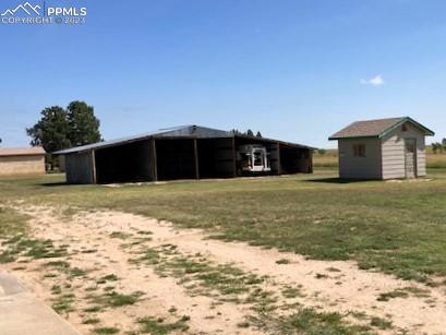 355 North Rush Road Rush, CO 80833 - Photo 19 of 41 a view of a house with a yard