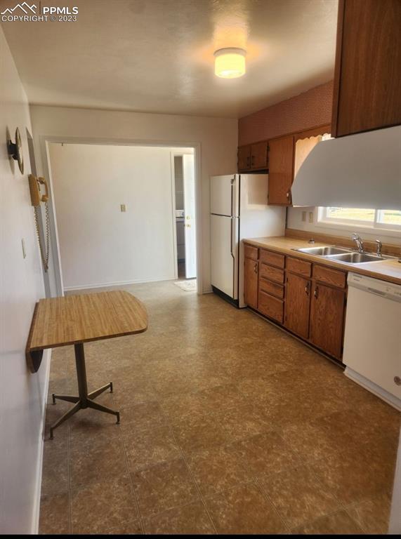 355 North Rush Road Rush, CO 80833 - Photo 3 of 41 a kitchen with stainless steel appliances granite countertop a sink and a refrigerator