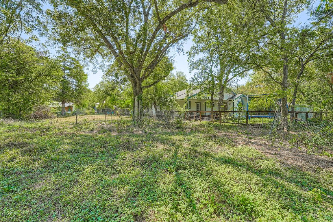 3706 Basford Road Austin, TX 78722 - Photo 6 of 12 a view of outdoor space with trees all around
