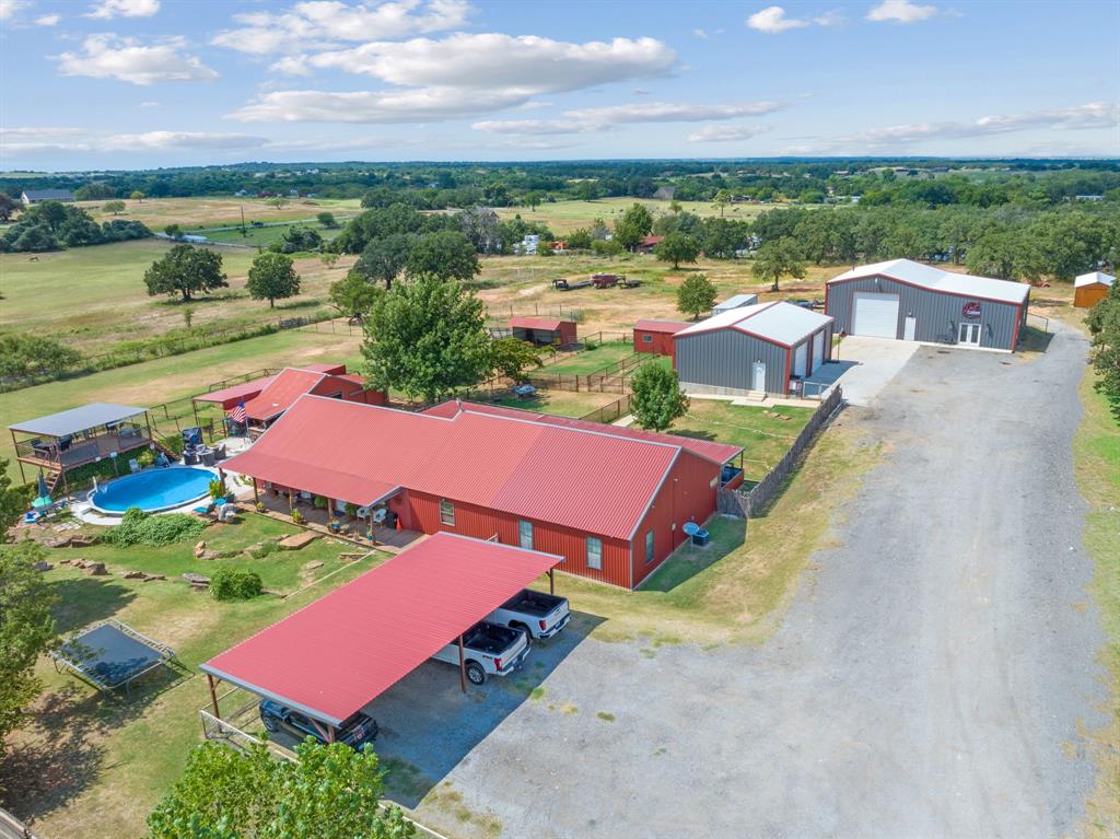 5058 West Highway 199 Springtown, TX 76082 - Photo 1 of 40 an aerial view of a house with a garden