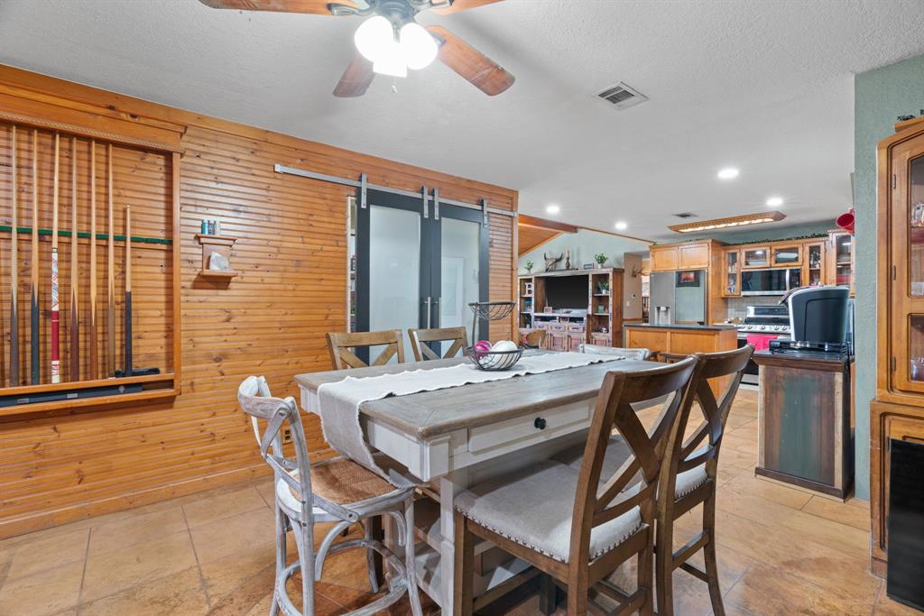 5058 West Highway 199 Springtown, TX 76082 - Photo 18 of 40 a view of a dining room with furniture and window