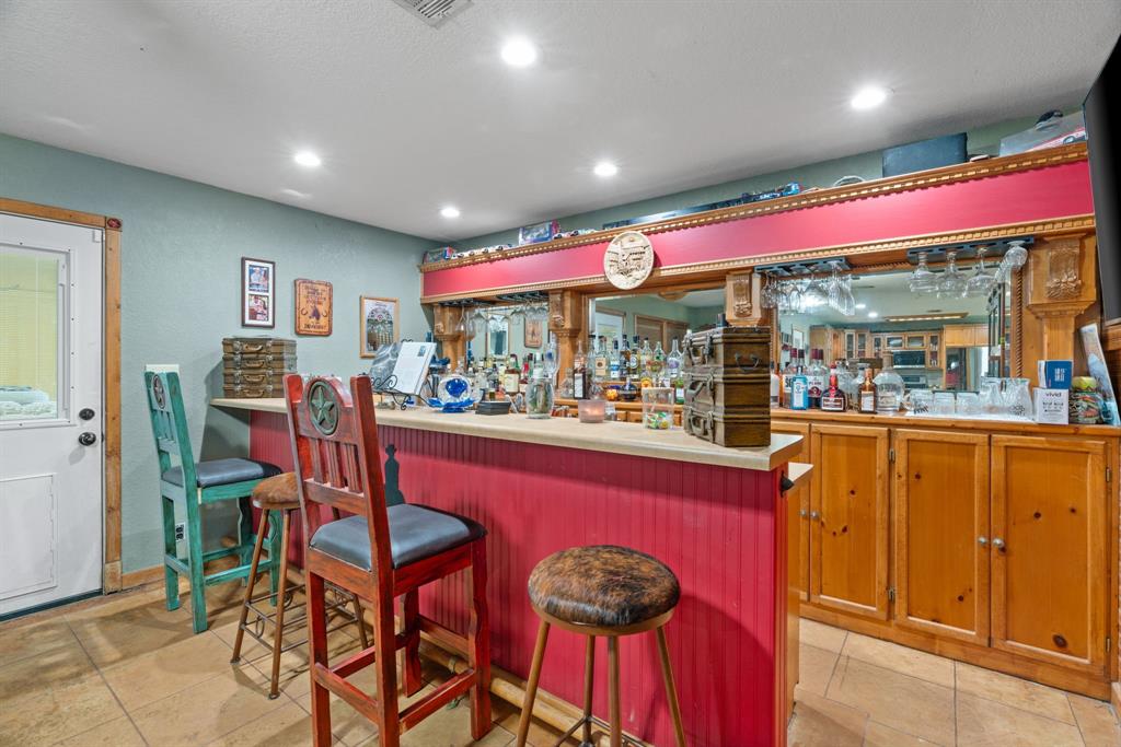 5058 West Highway 199 Springtown, TX 76082 - Photo 19 of 40 a view of a dining room with furniture