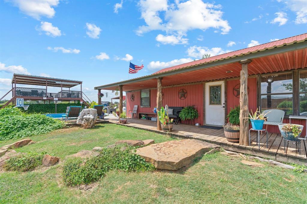 5058 West Highway 199 Springtown, TX 76082 - Photo 4 of 40 a view of a house with backyard porch and sitting area