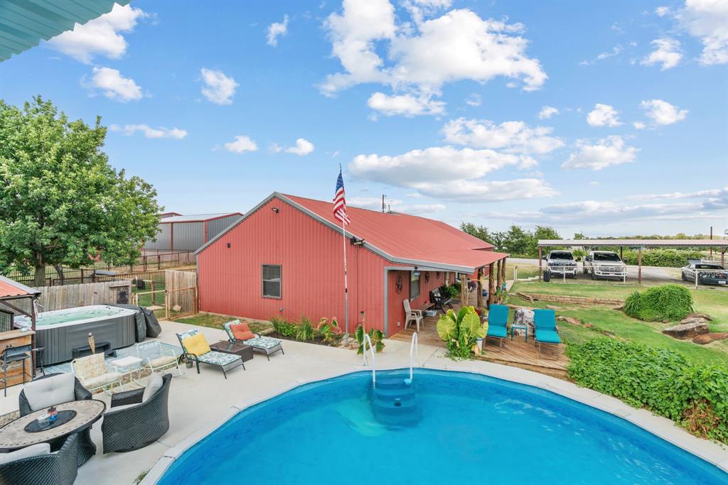 5058 West Highway 199 Springtown, TX 76082 - Photo 10 of 40 a front view of a house with garden