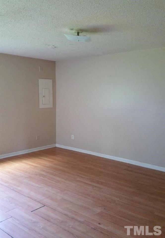 322 Junction Road, Unit 36A Durham, NC 27703 - Photo 5 of 10 a view of an empty room with wooden floor