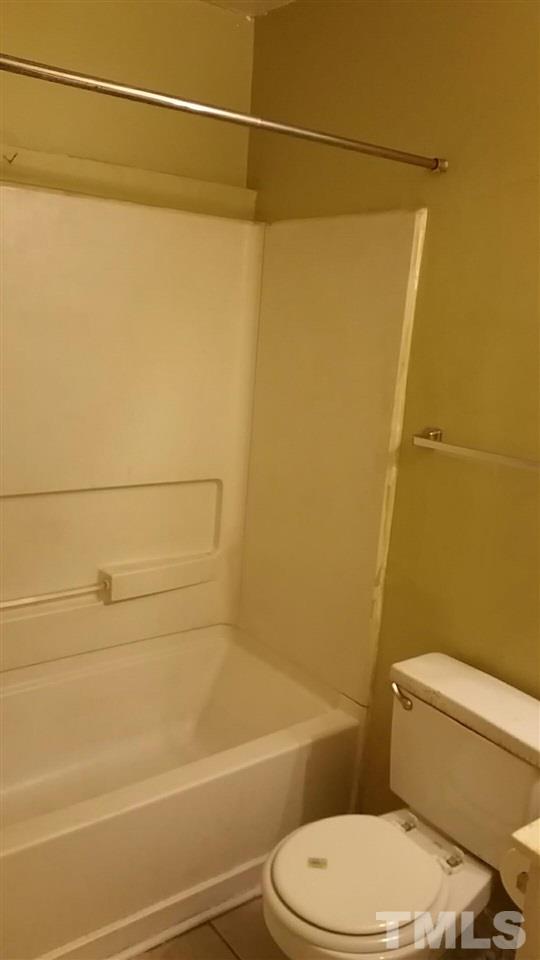 322 Junction Road, Unit 36A Durham, NC 27703 - Photo 6 of 10 a bathroom with a toilet and a shower