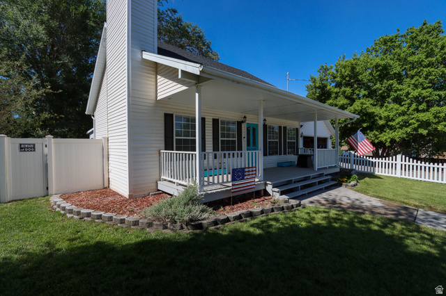 270 East 100 North Monroe, UT 84754 - Photo 2 of 65 White siding exterior with a covered porch and white railings